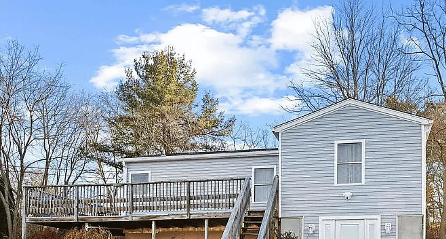 New siding, deck and entry on a shoreline colonial
