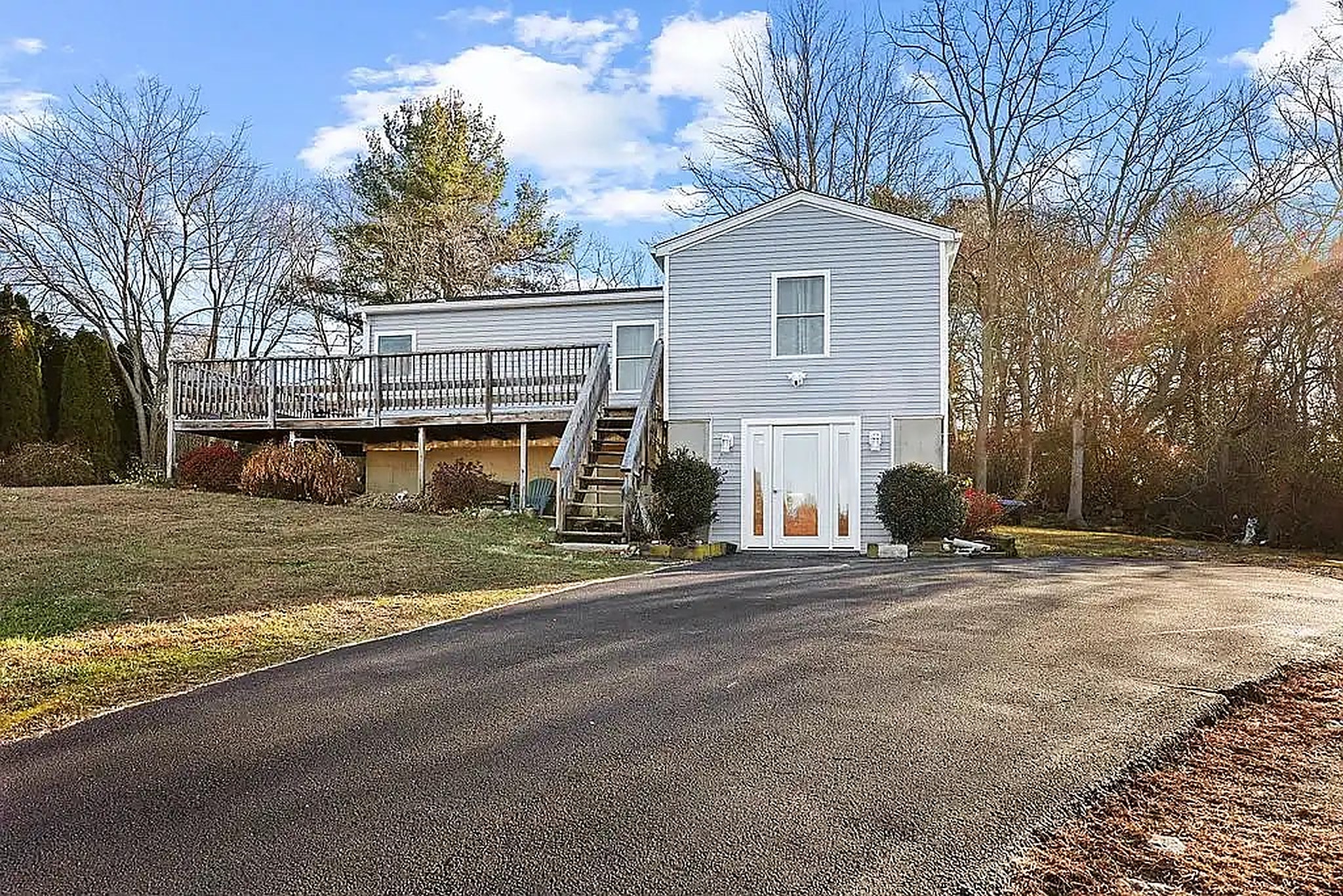 A Connecticut shoreline home after KMAX replaced the siding, deck and front entry