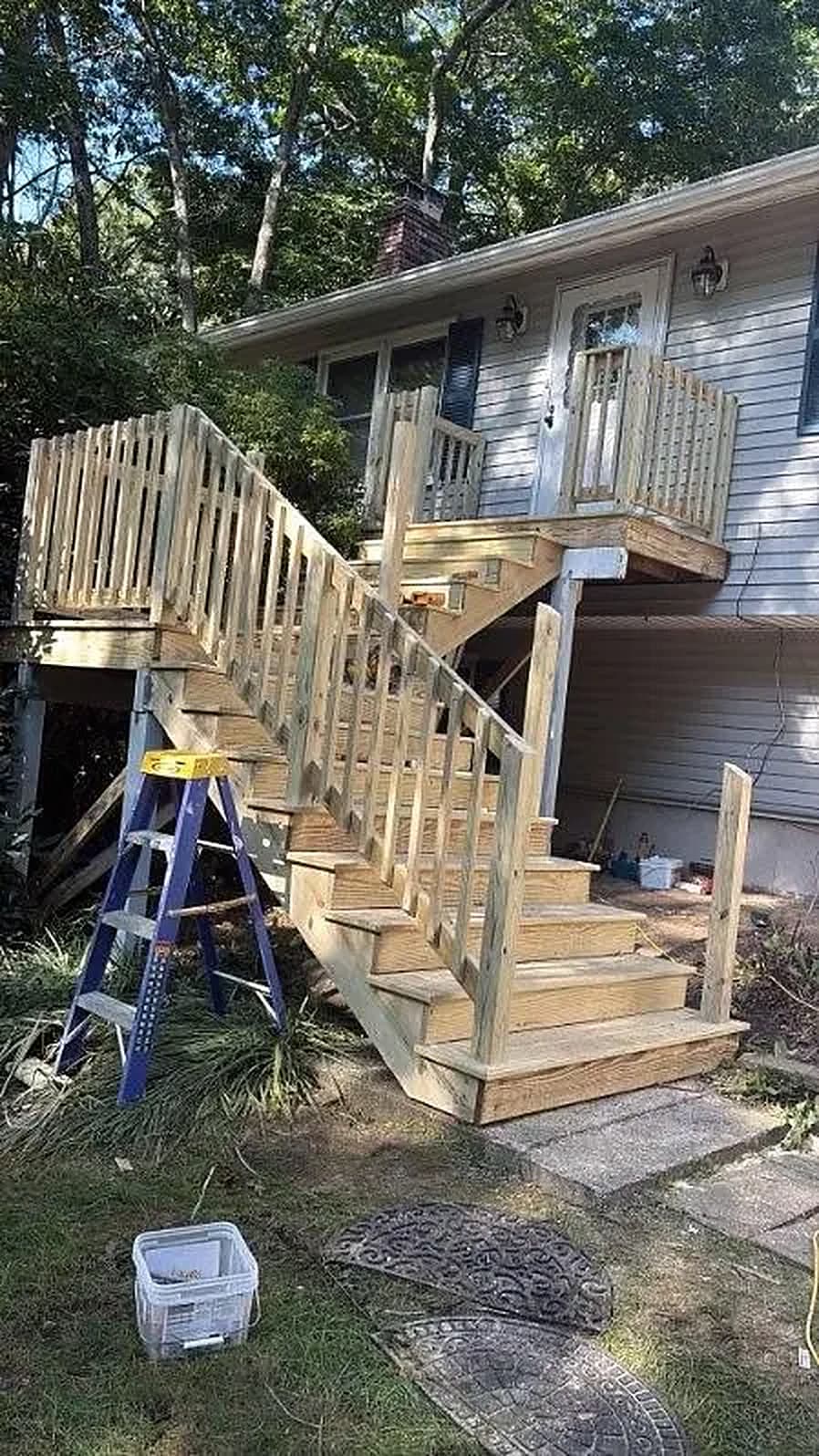 Finished exterior stairs and deck railing on a Connecticut home